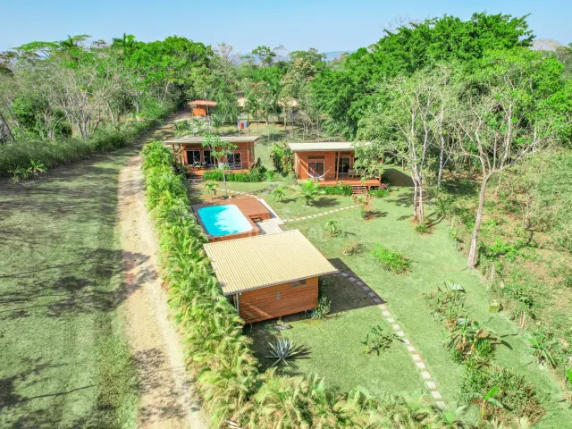 Turnkey Rental Opportunity: Charming Lodges with Pool Near Santa Teresa Beach