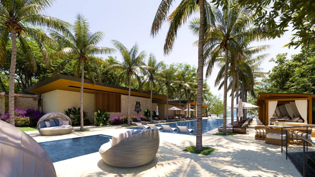 The Ocean Club pool terrace at Cantomar, shaded by palms and cabanas